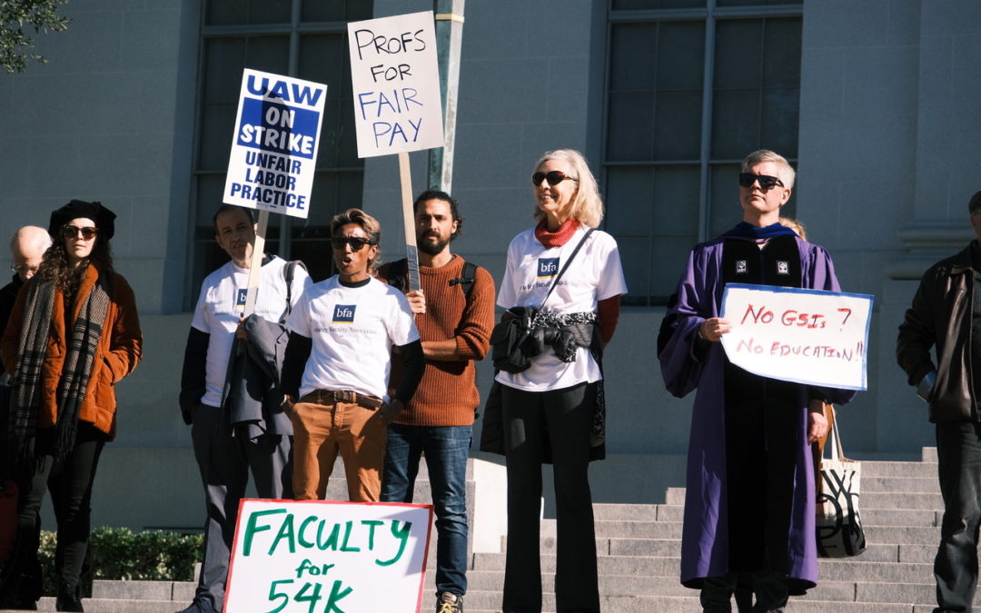 UCB faculty at the UAW strike wearing BFA t-shirts and carrying signs reading "Profs for Fair Pay" and "Faculty for 54K" and "No GSIs? No education!"